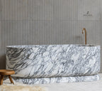 White Marble Queen Elizabeth Bathtub - Lifestyle Setting with Fluted Wall | Stonegems